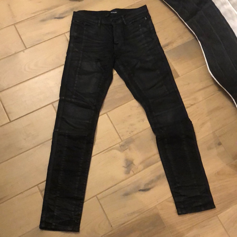 Black jeans with motorcycle detail, treated